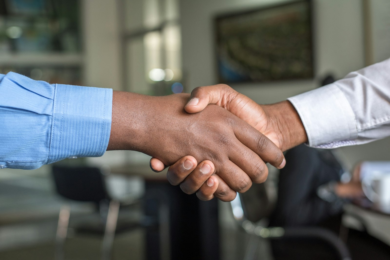 Business partnership handshake